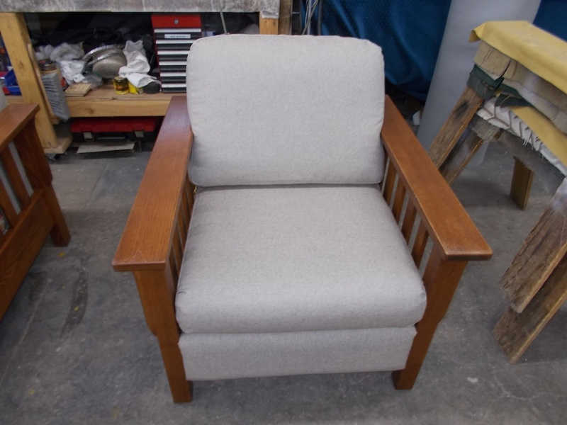 grey chair with wood arms